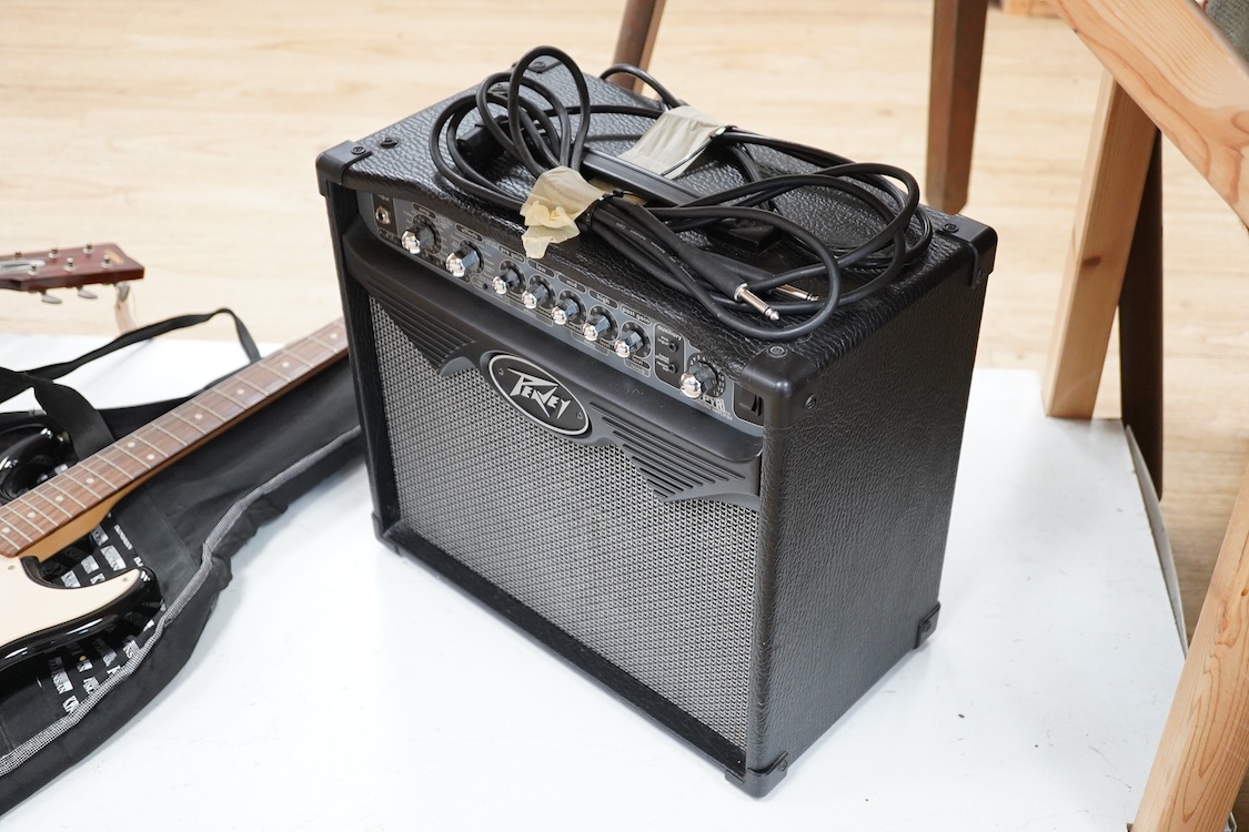 A Fender Squire electric guitar, with a Kinsman soft case, together with a Peavey VYPYR 15W modelling amplifier